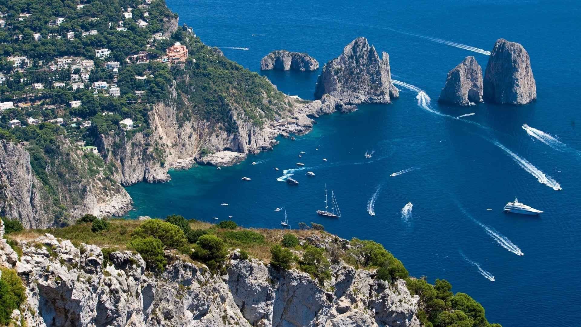 bay of naples capri italy boats moored rocks